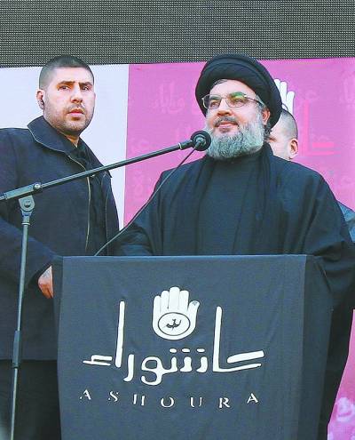 黎巴嫩真主党总书记纳斯鲁拉(右)6日在贝鲁特南郊举行的阿舒拉节